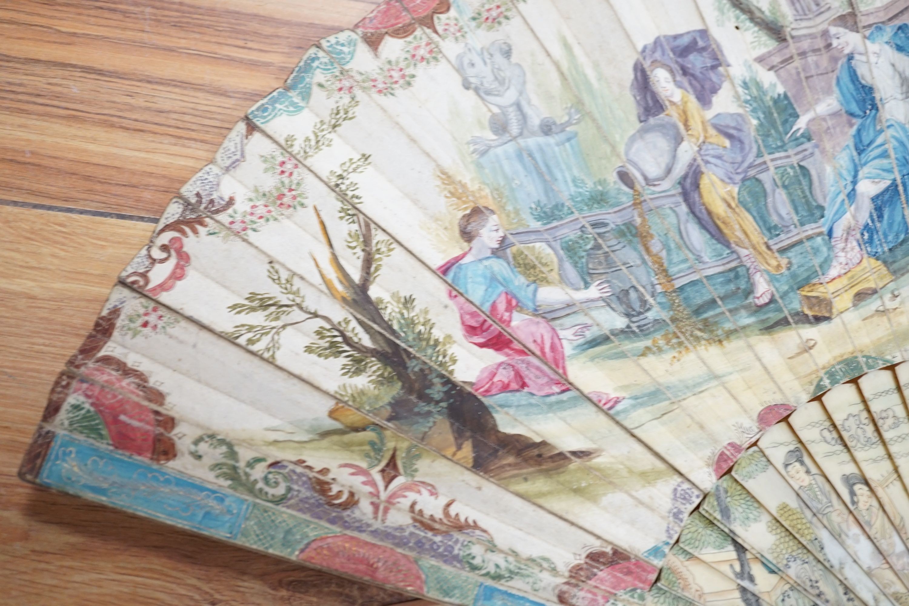 Five various fans, and an 18th century painted leaf fan with ivory chinoiserie decorated guards and sticks, 28 cms high (6)